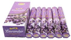 lavender incense sticks are stacked on top of each other