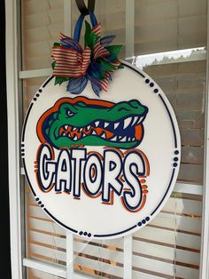 a florida gators door hanger hanging from the side of a window