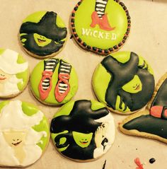 some decorated cookies with witches on them