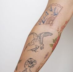 a woman's arm with tattoos on it