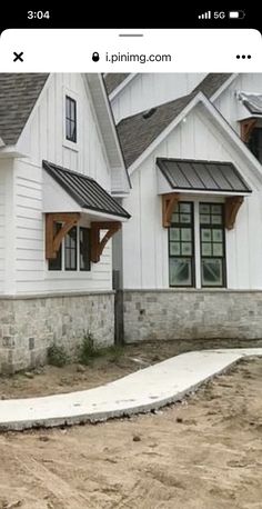 an image of a house being built on the side of a road in front of it