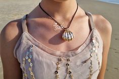 Introducing our shiny Gold Melody Shell Locket, inspired by "The Little Mermaid." This enchanting seashell pendant necklace is perfect for cosplay or as a mermaid lover's gift. With intricate detailing and a gold finish, it opens to hold cherished mementos. Embrace your inner mermaid and order yours today! The ball chain available in 2 colors of your choice - gold and black. You will love it this i can guarantee ! The Little Mermaid Melody, Mermaid Shell Necklace, Shell Locket, Mermaid Magic, Gold Locket Necklace, Mermaid Shell, Seashell Pendants, Mermaid Lover, Mermaid Necklace