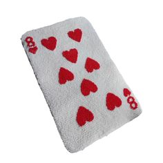 a white towel with red hearts on it