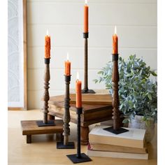 a group of candles sitting on top of a wooden table