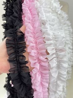 there are many ruffles on the back of a woman's arm and hand