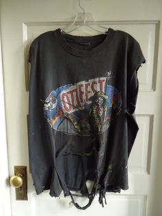 "TOTALLY TRASHED Ozzfest concert tee from 1999...DISTRESSED Vintage Condition...SOLD AS IS...thanks!! **DISTRESSED means there are imperfections that give the shirt character such as holes,stains,nubs, etc...NO RETURNS.** Measurements(Lying flat) Pit to pit:(across chest/bust) 25\" Top to bottom: 26\"(neck at tag to front hem) Tag: Photo 3 Original size: XLT estimated size: Today's L/XL (READ MEASUREMENTS) ATTN: PLEASE PAY CLOSE ATTENTION TO MY MEASUREMENTS...I will not take back an item if it d Distressing Shirts Diy, Distressed Grunge Tops For Music Festivals, Grunge Distressed Tops For Music Festivals, Diy Distressed Shirt, Rock Style Distressed T-shirt For Streetwear, Vintage Washed Black T-shirt For Concert, Distressed Band Merch T-shirt For Concert, Oversized Distressed Band Merch T-shirt, Grunge Tshirt