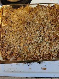 an uncooked casserole with oats in it on top of a stove