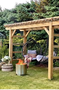 an outdoor fire pit in the middle of a yard