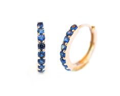 Blue Sapphire Hoop Earrings 12mm 9mm . 14k 18k Yellow White or Rose Gold . Sapphire Huggie Earrings . Small Hoop Earrings . Natural Sapphire The perfect, modern classic, huggie hoop earrings in top grade natural blue sapphire, available in two essential sizes: 9mm and 12mm outside diameter. Our closure is both neat and super secure. We have test driven these ourselves for many months. Specifications: 9mm Size ❂ Outside: 9 millimeter ❂ Inside: 6 millimeters ❂ Width: 1.6mm ❂ Height: 1.5mm ❂ Post: Sapphire Hoop Earrings, Earrings Small Hoop, Huggie Earrings Silver, Small Hoop Earrings, Huggie Earrings, Sapphire Earrings, Fine Jewelry Designers, Natural Blue Sapphire, Huggie Hoop Earrings