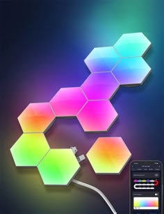 a cell phone is plugged in to a colorful hexagonal wallpaper design