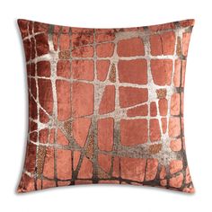 an orange and brown pillow with squares on it