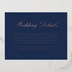 a card with the words wedding vows on it in gold and navy blue, sitting on a marble surface