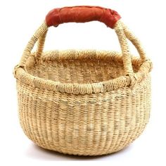 a woven basket with a red handle on the top and bottom, sitting in front of a white background