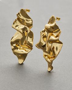 "Find ALEXIS BITTAR Crumpled Large Post Earring on Editorialist. Details Designed in 2008, our \"crumpled\" 14k gold plated metalwork lends itself perfectly to this large diamond shape. Creating a miniature sculpture which reflects light in the folds of the metalwork. 14k gold plated brass, surgical steel posts Weight: 20g, medium weight UPC: 889519114343 Measurements 3\" x 1.5\" Care To clean these large gold sculptural post earrings, gently wipe the surface with a soft cloth. For additional care instructions visit our FAQ page. FAQs What are the materials that make up these large gold sculptural post earrings? The materials that are used in these large gold sculptural post earrings are signature materials of the Alexis Bittar jewelry collection. Combinations of custom metalwork encapsula Large Gold Earrings, Miniature Sculpture, Alexis Bittar Jewelry, African Earrings, Gold Statement Earrings, Stylish Earring, Alexis Bittar, Big Earrings, Contemporary Jewellery