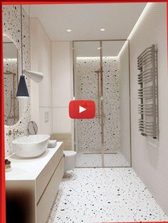 a bathroom with a walk in shower next to a white sink and toilet under a red frame