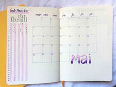 an open planner with the word mail written in purple and pink ink on top of it