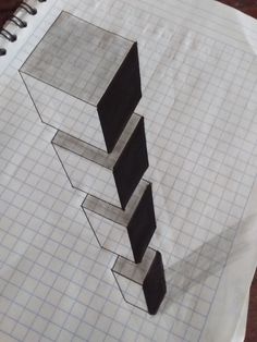 a piece of paper that has been drawn on with graph paper and some pencils