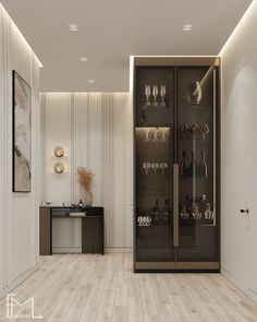 a room that has a glass door and shelves with wine glasses on it in the corner