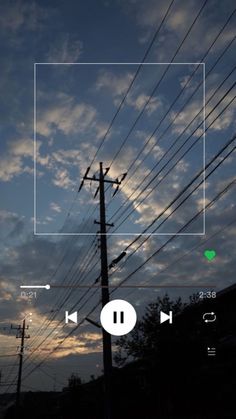 an image of power lines with the sky in the back ground and clouds in the background