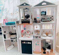 a doll house with all the furniture and accessories