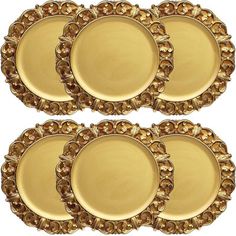 set of four gold plates with decorative designs