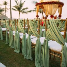 rows of chairs with green sashes on them