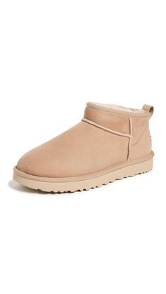 PRICES MAY VARY. 17mm Twinface sheepskin upper 17mm sheepskin lining 17mm UGGplush upcycled wool, lyocell sockliner Sugarcane EVA outsole Ugg Classic Ultra Mini Boots, Womens Cute Shoes, Chte Shoes, Cute Shoes To Buy, Shoes 2024 Women, Ugg Ultra Mini Sand, Cute Affordable Shoes, Ugh Mini Boots, Shoes Shuffle