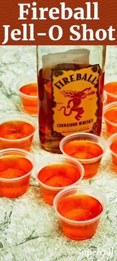 fireball jell - o shot in plastic cups on a table