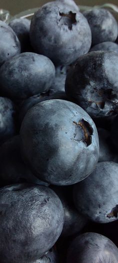 a pile of blueberries sitting on top of each other