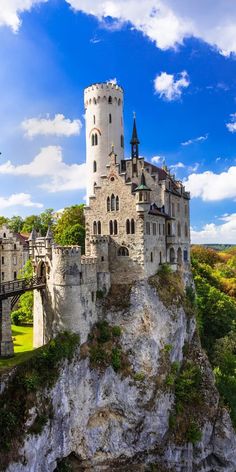 an old castle sitting on top of a cliff