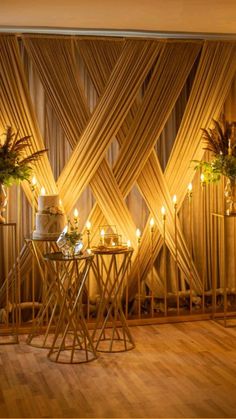 the room is decorated with candles and vases on tables in front of bamboo screens