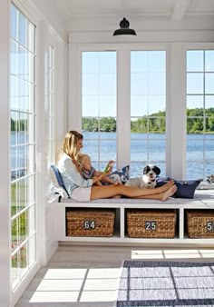 What a sunroom! A beautiful view from a Michigan cottage, plus ample storage for games and books from the 14-foot window seat’s cubby baskets. More photos from this home: http://www.midwestliving.com/homes/featured-homes/house-tour-lake-house-effect?page=1 Pool Sunroom, Michigan Cottage, Bay Window Seat, Sunroom Ideas, Sunrooms, Beach Cottage Style, Window Seat