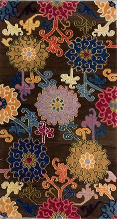 a brown rug with colorful flowers on it