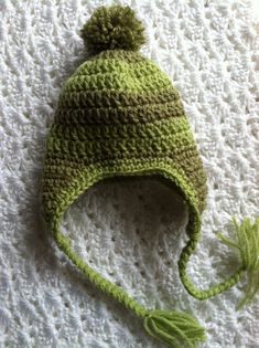 "Adorable crochet baby hats with earflaps in green stripes.  PERFECT for newborn photos    So cute!  Excellent warm and snuggly hat for winter!  Lovely \"crochet baby hat with earflaps and pompon\". All acrylic yarn in \"Greens\" has been used. Perfect for shower gifts or any occasion. This is great for any of baby's outings, riding in the car seat or stroller.  Great for newborn photos  So cute for winter outings!  Material: 100% Acrylic Measures: The size of the hats that are pictured are appr Heirloom Baby Blankets, Hat For Winter, Crochet Baby Hat, Adorable Crochet, Newborn Hat, Hat Crochet, Crochet Baby Hats, Baby Head, Crochet Baby Patterns