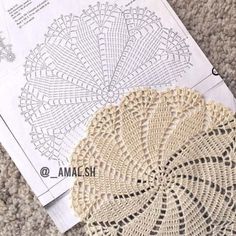 two crocheted doily on the ground next to each other, one with an openwork design