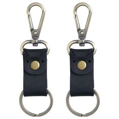 pair of black leather keychains with metal rings on each side and an oval ring at the end