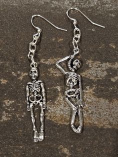 Killer silver earrings! Scary skeleton 💀 earrings! The charms on these killer earrings are 925 silver finish, and the entire earwire and ball are 925 STERLING SILVER. They hang approx 2-3" inches. The earwire is about .75", and the skeleton charms are approximately 2"inches long.  They are very lightweight.  Thanks, Enjoy! #awesome #killer #postpunk #rocker #bikerchick #gothic #punk #tattoos #unisex #medieval #gift #kitschy #925sterlingsilver #anime #earrings #skulls #skeleton #horror #badass Punk Skull Jewelry For Halloween, Punk Style Skull Jewelry For Halloween, Silver Emo Jewelry For Halloween, Silver Skull Emo Jewelry, Edgy Sterling Silver Jewelry For Halloween, Edgy Sterling Silver Dangle Earrings, Punk Style Hand Cast Halloween Jewelry, Silver Punk Jewelry For Halloween, Edgy Handmade Silver Earrings