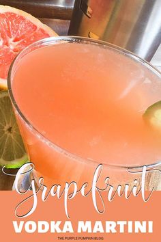 the grapefruit vodka martini is garnished with an orange slice