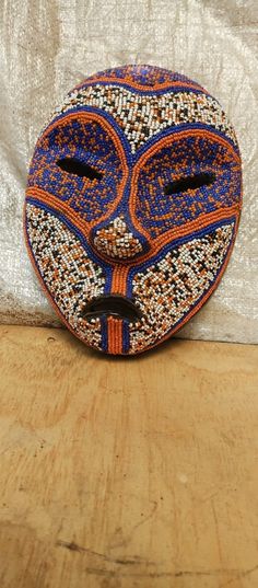 This piece is an original Congolese beaded Boa Tribe decorative beaded mask from DRC and measures appx: 11.5x8.8x4 inch. Weight is appx: 1.5kg. Mid 1990's. Ships fast via DHL or Aramex Express Courier. For some of the best original African art items, check my listings frequently. Each piece is one-of-a-kind. Do you like this item? Then make me an offer. --Message me on Etsy or call me on my mobile or thru whatsapp. Check my profile. --All sales go thru Etsy. --See our other shop too at: www.etsy African Tribe, Beaded Mask, Art Items, Art Carved, Masks Art, African Masks, Bags Aesthetic, World Cultures, Bead Art