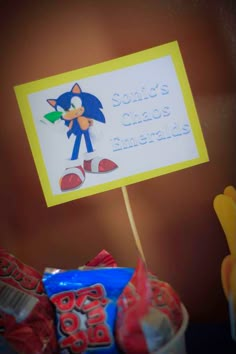 there is a sign that says sonic's chaos emeralds on top of some candy