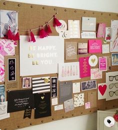 a bulletin board covered in lots of different items and decorations on it's side