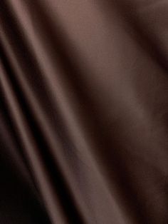 a close up view of a dark brown fabric