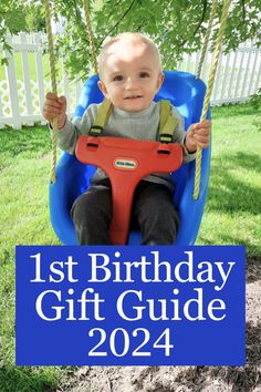 a baby sitting in a blue swing with the words 1st birthday gift guide on it