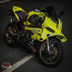 a yellow motorcycle parked in a parking lot