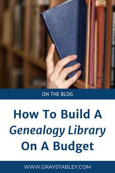 a person holding a book in front of bookshelves with the title how to build a