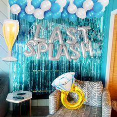 a party scene with balloons and streamers in the shape of letters that read last splash