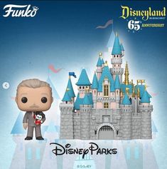 the disney parks pop vinyl figure is shown in front of a castle