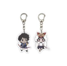 two keychais with anime characters on them, one has a cat and the other has