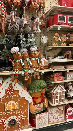 christmas decorations and gingerbreads on display in a store