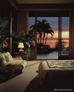 a bedroom with an ocean view is shown in this image at night, and there are palm trees outside the window